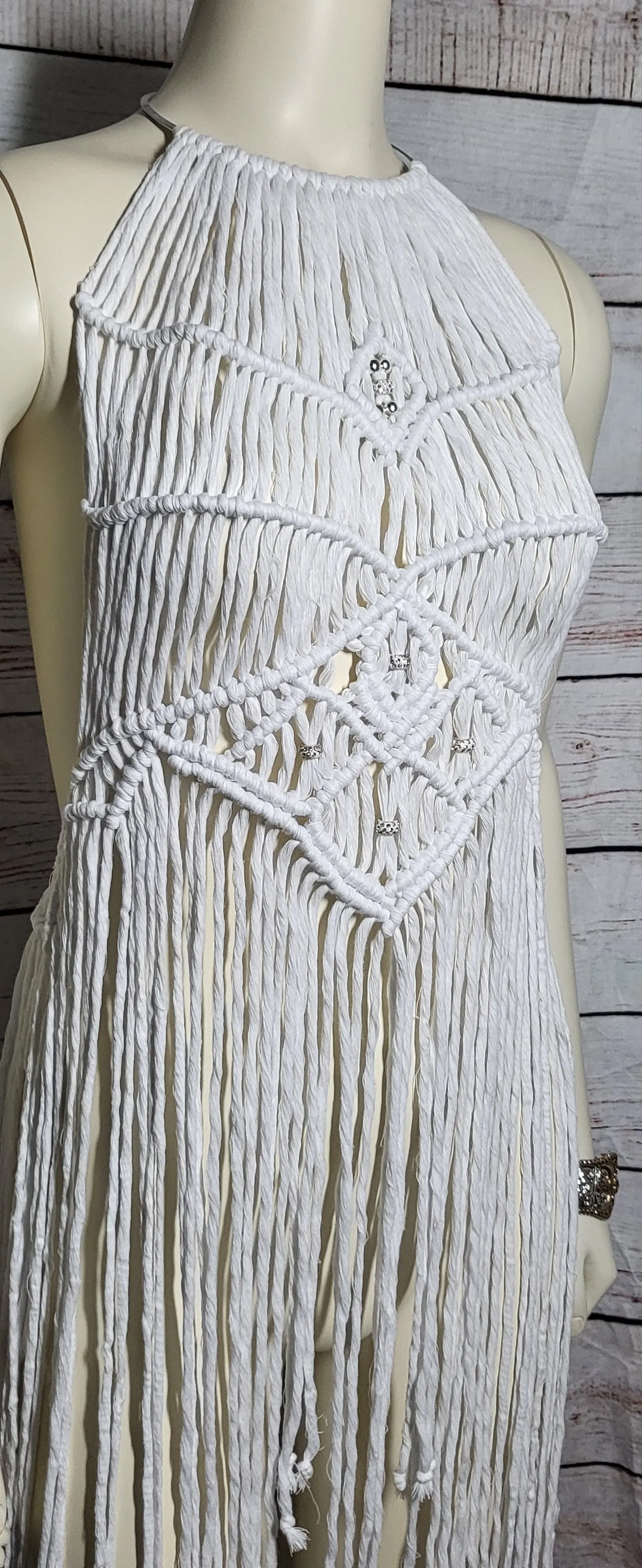 White macrame beach festival dress with silver necklace choker.